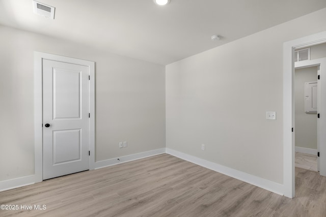 208 Triton Ln, Surf City, NC 28445 - spare room featuring light wood-style flooring, a smoke detector, and recessed lighting