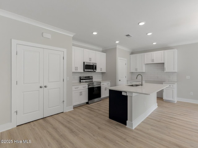 208 Triton Ln, Surf City, NC 28445 - kitchen with appliances with stainless steel finishes, ornamental molding, backsplash, white cabinets, and recessed lighting