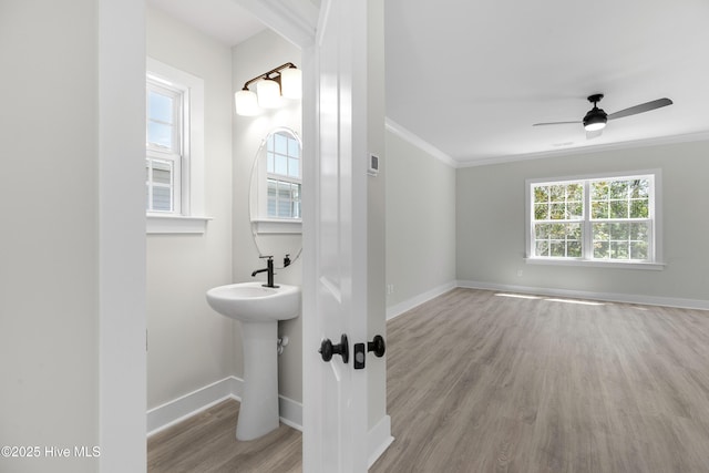 208 Triton Ln, Surf City, NC 28445 - bathroom featuring wood finished floors, ornamental molding, and ceiling fan