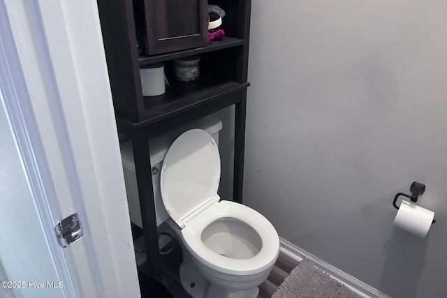 2903 Cedar Creek Rd Apt B, Greenville, NC 27834 - bathroom featuring toilet and wood finished floors