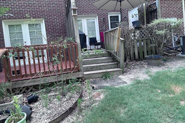 2903 Cedar Creek Rd Apt B, Greenville, NC 27834 - property entrance with brick siding, a wooden deck, and french doors