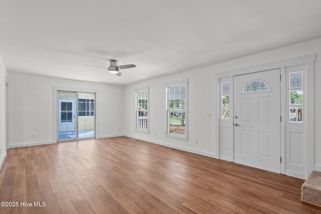 108 NW 29th St, Oak Island, NC 28465 - entrance foyer with hardwood / wood-style flooring, healthy amount of natural light, and ceiling fan