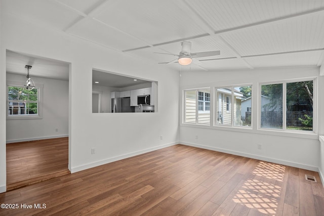 108 NW 29th St, Oak Island, NC 28465 - unfurnished room with hardwood / wood-style floors and a ceiling fan