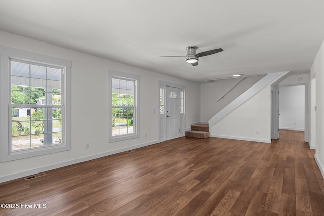 108 NW 29th St, Oak Island, NC 28465 - foyer entrance featuring dark wood-type flooring, a ceiling fan, and stairs