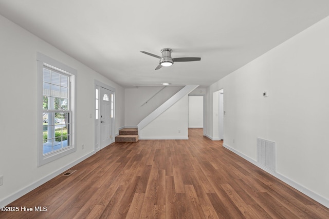 108 NW 29th St, Oak Island, NC 28465 - unfurnished living room featuring wood finished floors and ceiling fan