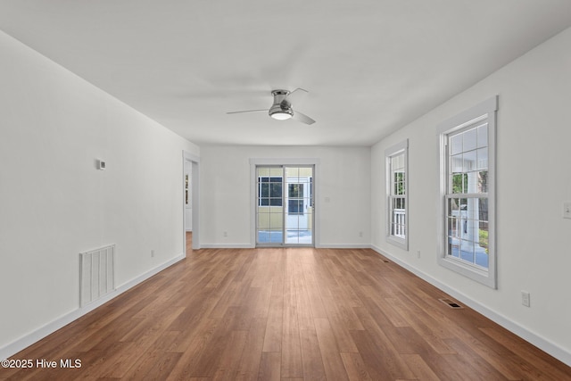 108 NW 29th St, Oak Island, NC 28465 - unfurnished room with wood finished floors and ceiling fan