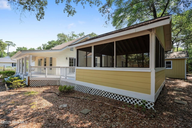 108 NW 29th St, Oak Island, NC 28465 - back of property featuring a sunroom