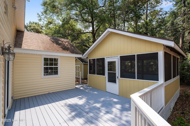 108 NW 29th St, Oak Island, NC 28465 - wooden deck with a sunroom
