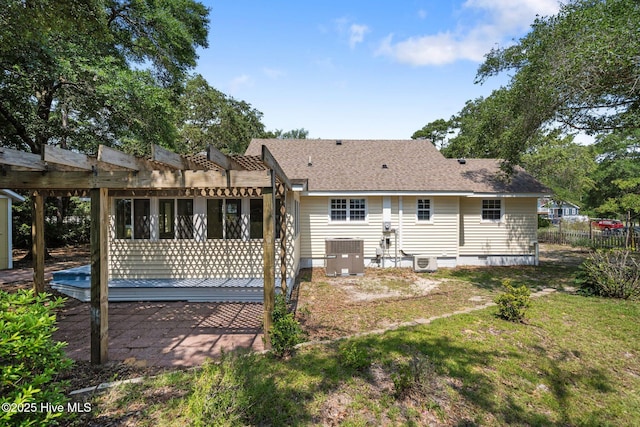 108 NW 29th St, Oak Island, NC 28465 - back of property featuring a patio, a pergola, crawl space, and a shingled roof