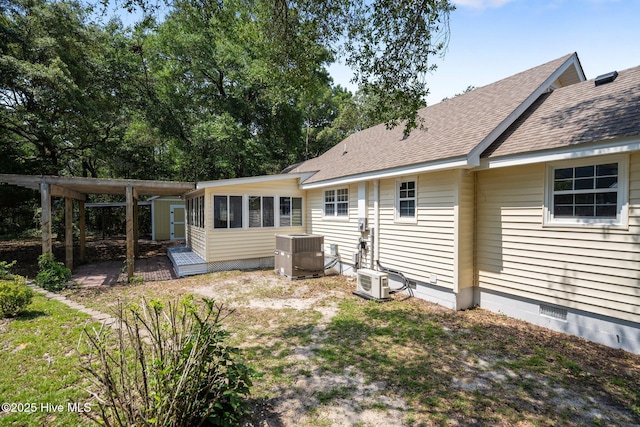 108 NW 29th St, Oak Island, NC 28465 - rear view of property with roof with shingles