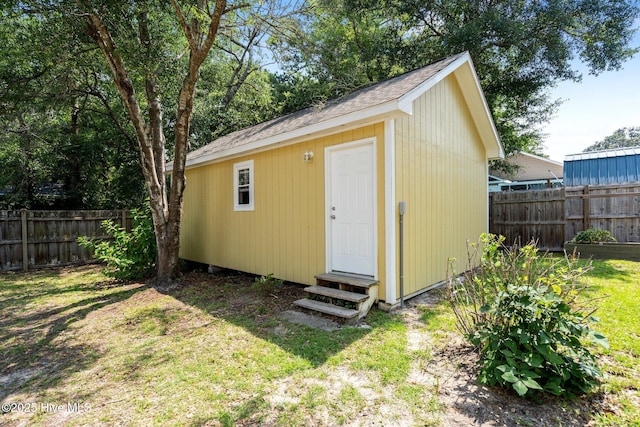 108 NW 29th St, Oak Island, NC 28465 - view of outbuilding with entry steps and a fenced backyard