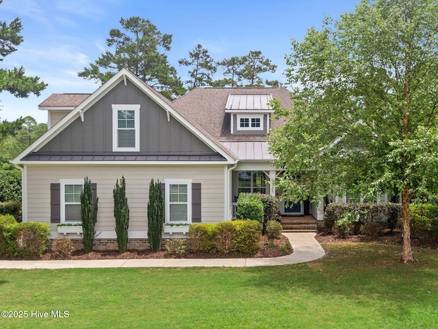 9385 Fallen Pear Ln NE, Leland, NC 28451 - craftsman inspired home featuring a standing seam roof, a front yard, and a metal roof