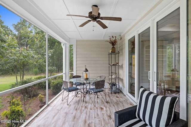 9385 Fallen Pear Ln NE, Leland, NC 28451 - sunroom with ceiling fan and outdoor dining space
