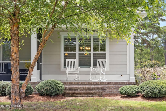 9385 Fallen Pear Ln NE, Leland, NC 28451 - view of front facade featuring a porch