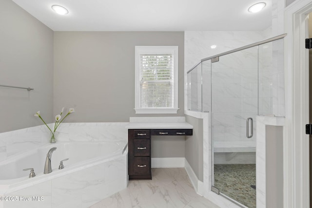 9385 Fallen Pear Ln NE, Leland, NC 28451 - bathroom featuring a garden tub, a stall shower, and marble finish floors