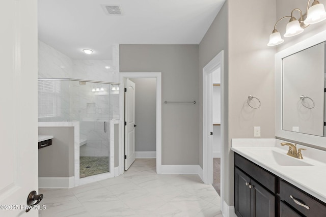 9385 Fallen Pear Ln NE, Leland, NC 28451 - full bathroom with marble finish floors, a stall shower, and vanity