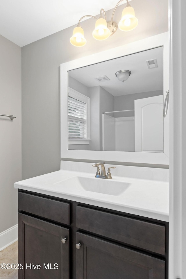9385 Fallen Pear Ln NE, Leland, NC 28451 - bathroom featuring vanity and baseboards