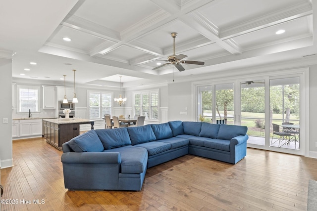 9385 Fallen Pear Ln NE, Leland, NC 28451 - living area with ceiling fan, light wood-style floors, crown molding, coffered ceiling, and beamed ceiling