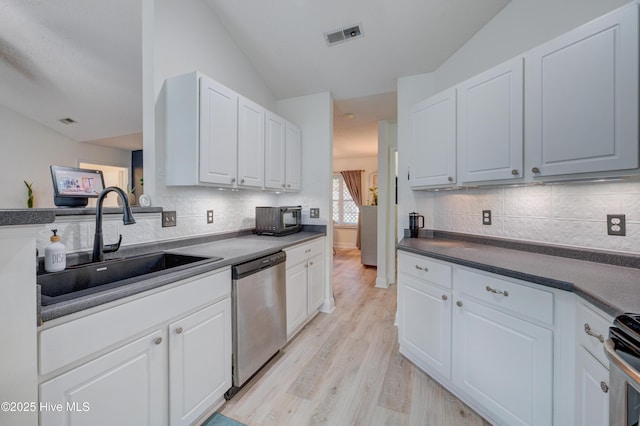 660 Pine Branches Cir SE, Leland, NC 28451 - kitchen featuring dishwasher, light wood-style floors, white cabinetry, and tasteful backsplash