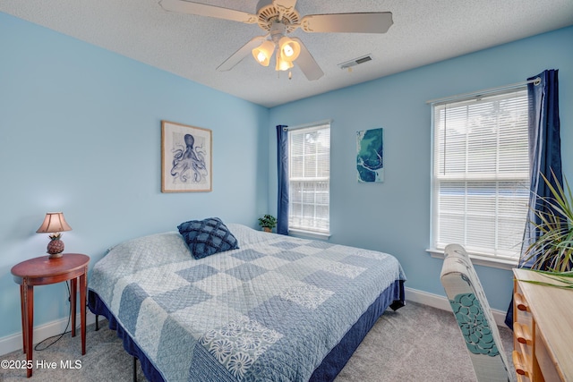660 Pine Branches Cir SE, Leland, NC 28451 - bedroom with carpet, ceiling fan, and a textured ceiling