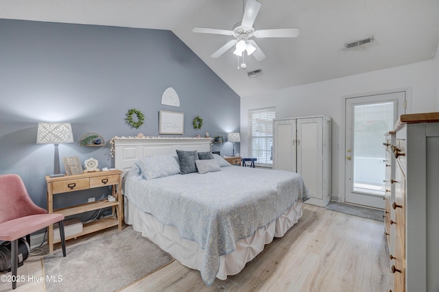 660 Pine Branches Cir SE, Leland, NC 28451 - bedroom with light wood-type flooring, high vaulted ceiling, multiple windows, and ceiling fan