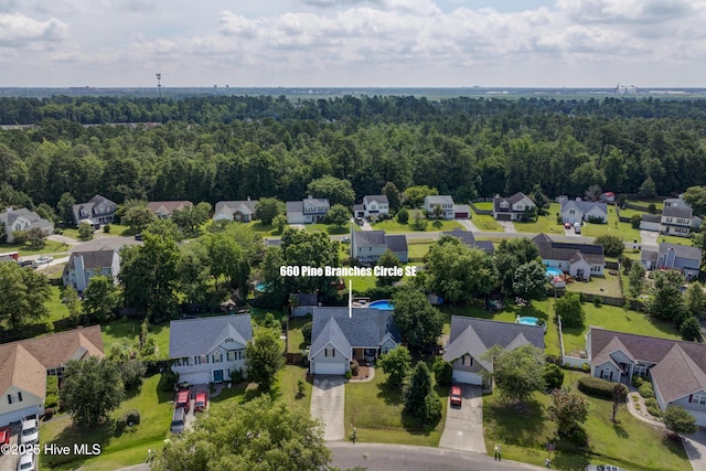 660 Pine Branches Cir SE, Leland, NC 28451 - aerial view of residential area featuring a heavily wooded area