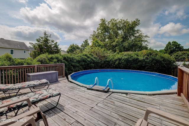 660 Pine Branches Cir SE, Leland, NC 28451 - swimming pool featuring a wooden deck