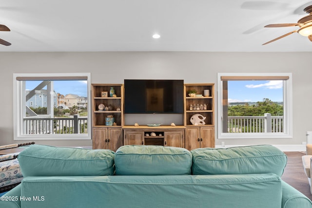 6626 W Beach Dr, Oak Island, NC 28465 - living room featuring a ceiling fan, wood finished floors, and recessed lighting