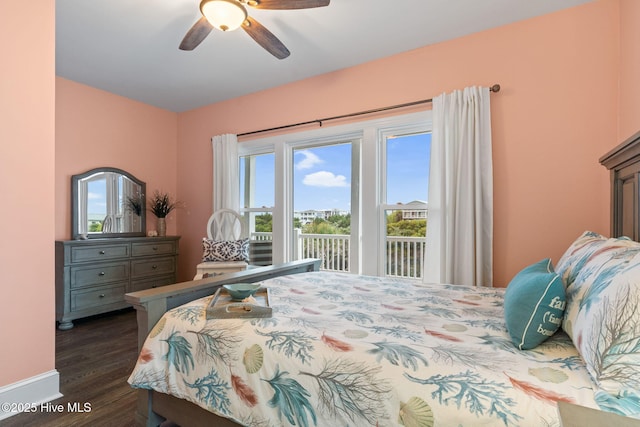 6626 W Beach Dr, Oak Island, NC 28465 - bedroom featuring access to exterior, dark wood-type flooring, and ceiling fan