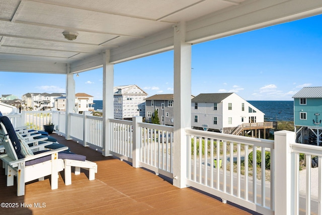 6626 W Beach Dr, Oak Island, NC 28465 - wooden deck with a residential view and a water view