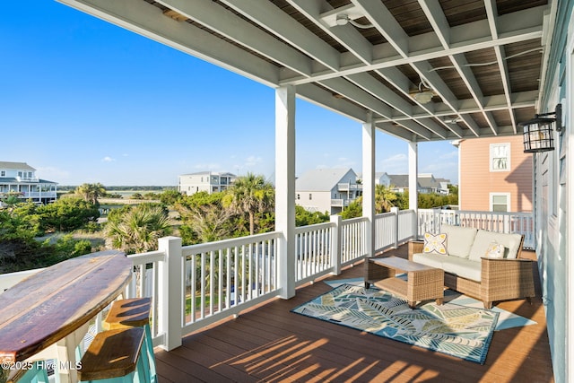 6626 W Beach Dr, Oak Island, NC 28465 - deck with an outdoor living space and a residential view