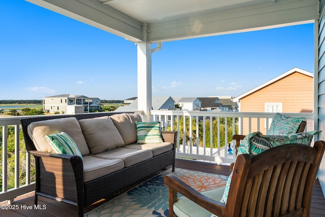 6626 W Beach Dr, Oak Island, NC 28465 - balcony featuring a residential view and an outdoor living space