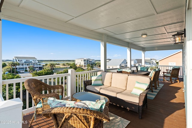 6626 W Beach Dr, Oak Island, NC 28465 - deck featuring an outdoor hangout area and a residential view