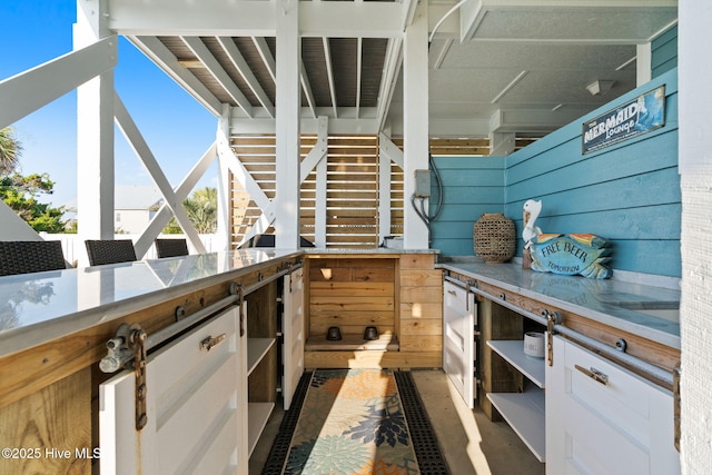 6626 W Beach Dr, Oak Island, NC 28465 - view of patio with area for grilling and stairway