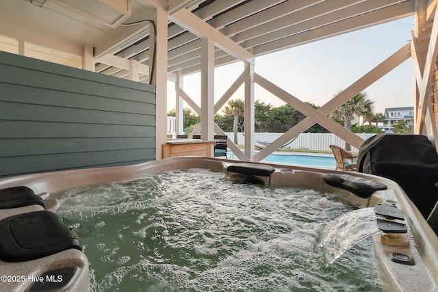 6626 W Beach Dr, Oak Island, NC 28465 - view of patio / terrace featuring a hot tub