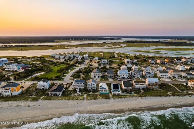 6626 W Beach Dr, Oak Island, NC 28465 - aerial perspective of suburban area with expansive beach