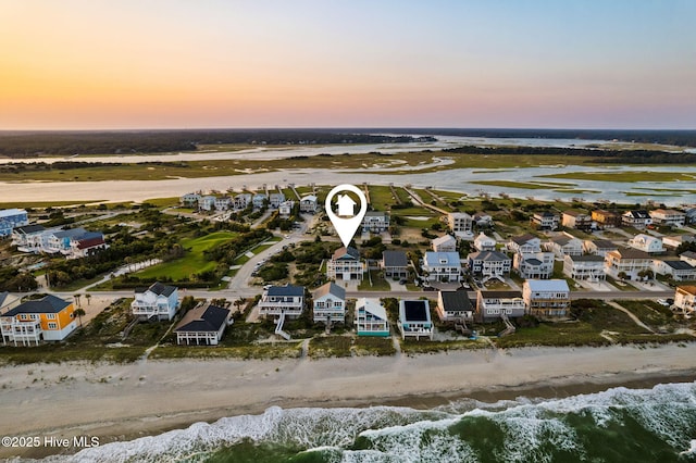 6626 W Beach Dr, Oak Island, NC 28465 - aerial view at dusk of view of water and beach and a residential view