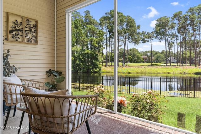 3710 Calla Lilly Ct, Southport, NC 28461 - sunroom / solarium featuring a water view and view of wooded area