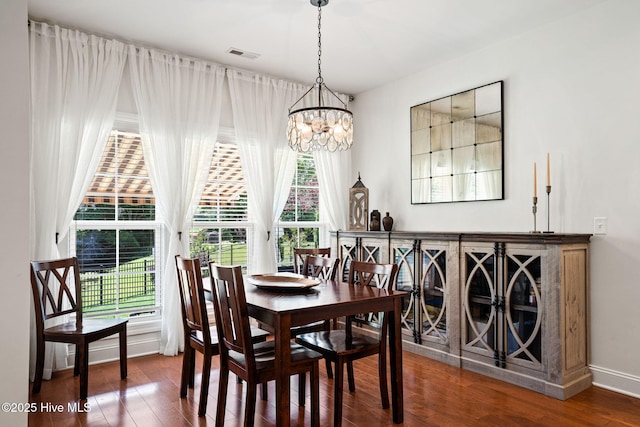 3710 Calla Lilly Ct, Southport, NC 28461 - dining space with a chandelier and wood finished floors