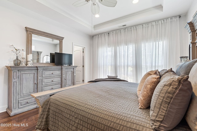 3710 Calla Lilly Ct, Southport, NC 28461 - bedroom with dark wood finished floors, a raised ceiling, recessed lighting, and a ceiling fan