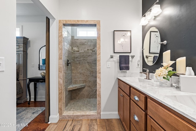 3710 Calla Lilly Ct, Southport, NC 28461 - full bathroom featuring a tile shower, double vanity, and wood finished floors
