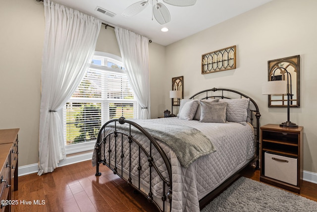 3710 Calla Lilly Ct, Southport, NC 28461 - bedroom featuring multiple windows, wood finished floors, recessed lighting, and a ceiling fan