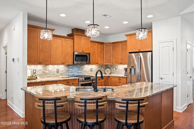 3710 Calla Lilly Ct, Southport, NC 28461 - kitchen with appliances with stainless steel finishes, a chandelier, dark wood-style floors, decorative backsplash, and recessed lighting