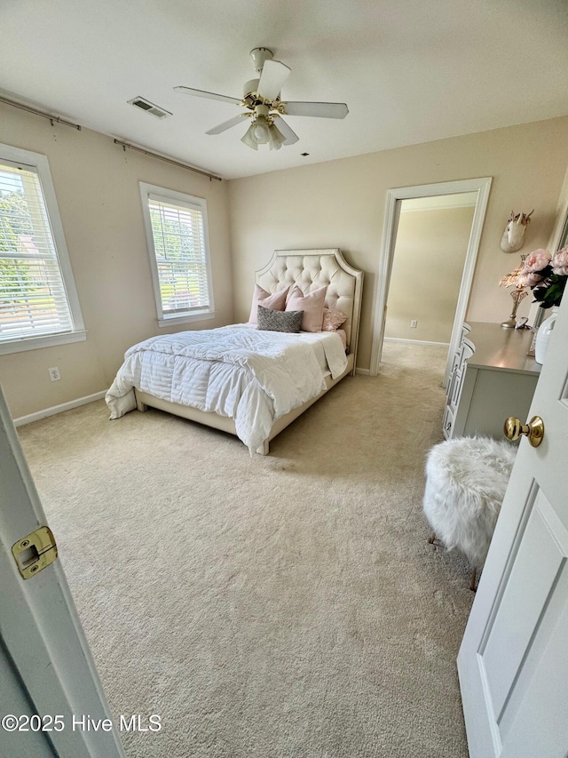 280 Green Forest Cir, Dunn, NC 28334 - bedroom with light colored carpet and a ceiling fan