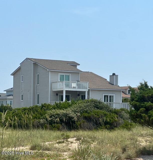 27 Silversides Trl, Bald Head Island, NC 28461 - back of house with a chimney