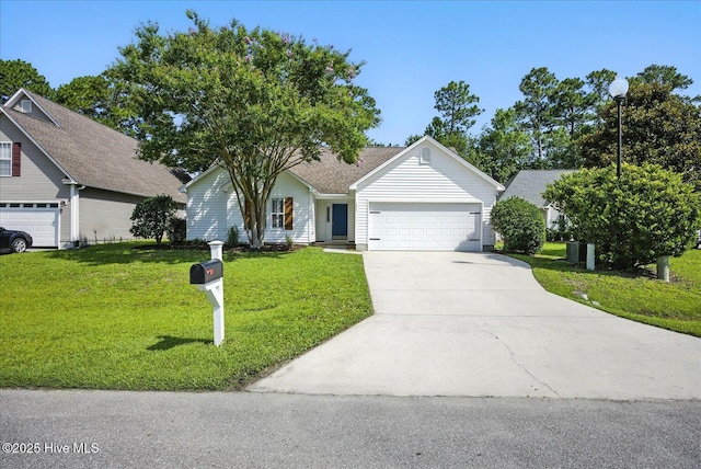 111 Yaupon Ct, Hampstead, NC 28443 - single story home with concrete driveway, a garage, and a front lawn