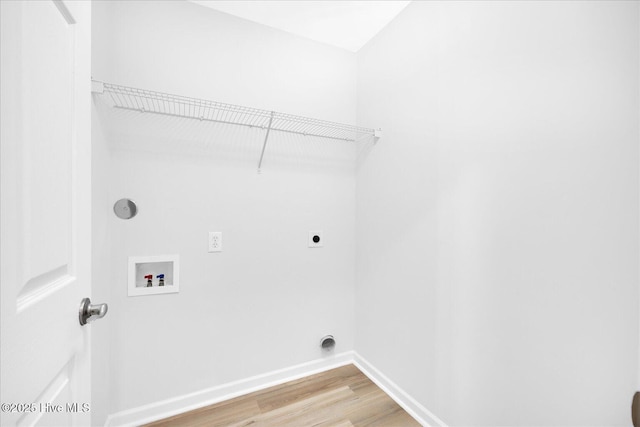 111 Yaupon Ct, Hampstead, NC 28443 - washroom with hookup for an electric dryer, hookup for a washing machine, and light wood-type flooring