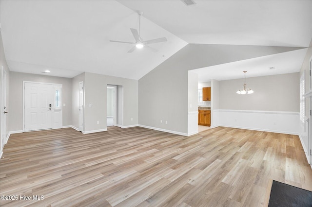 111 Yaupon Ct, Hampstead, NC 28443 - unfurnished living room with a chandelier, lofted ceiling, ceiling fan, light wood finished floors, and recessed lighting