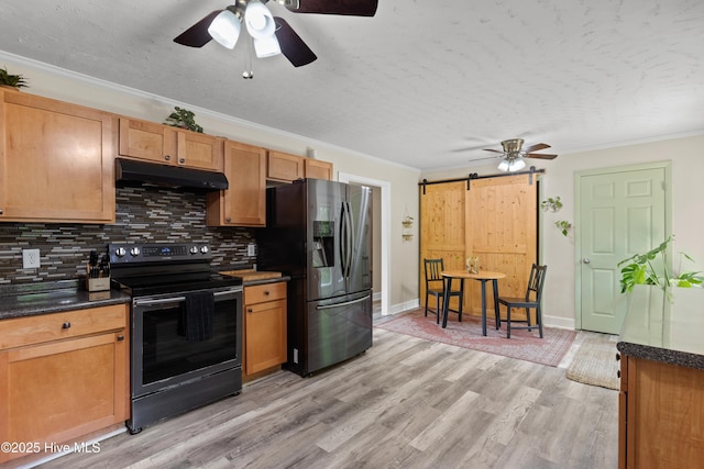 202 Regalwood Dr, Jacksonville, NC 28546 - kitchen featuring black range with electric stovetop, under cabinet range hood, stainless steel fridge, a barn door, and ceiling fan