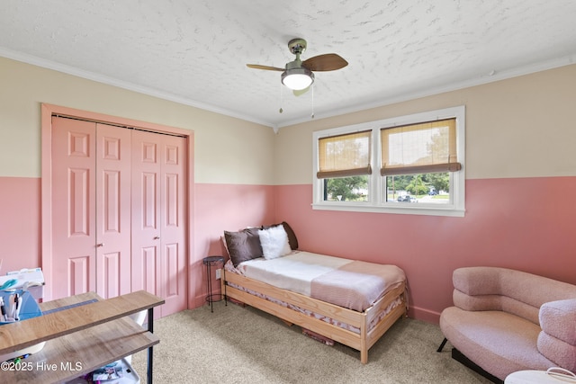 202 Regalwood Dr, Jacksonville, NC 28546 - bedroom with light carpet, a closet, crown molding, ceiling fan, and a textured ceiling